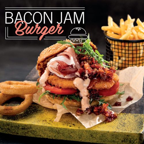 A decadent chicken schnitzel burger with Prosciutto and a scrumptious bacon jam sauce